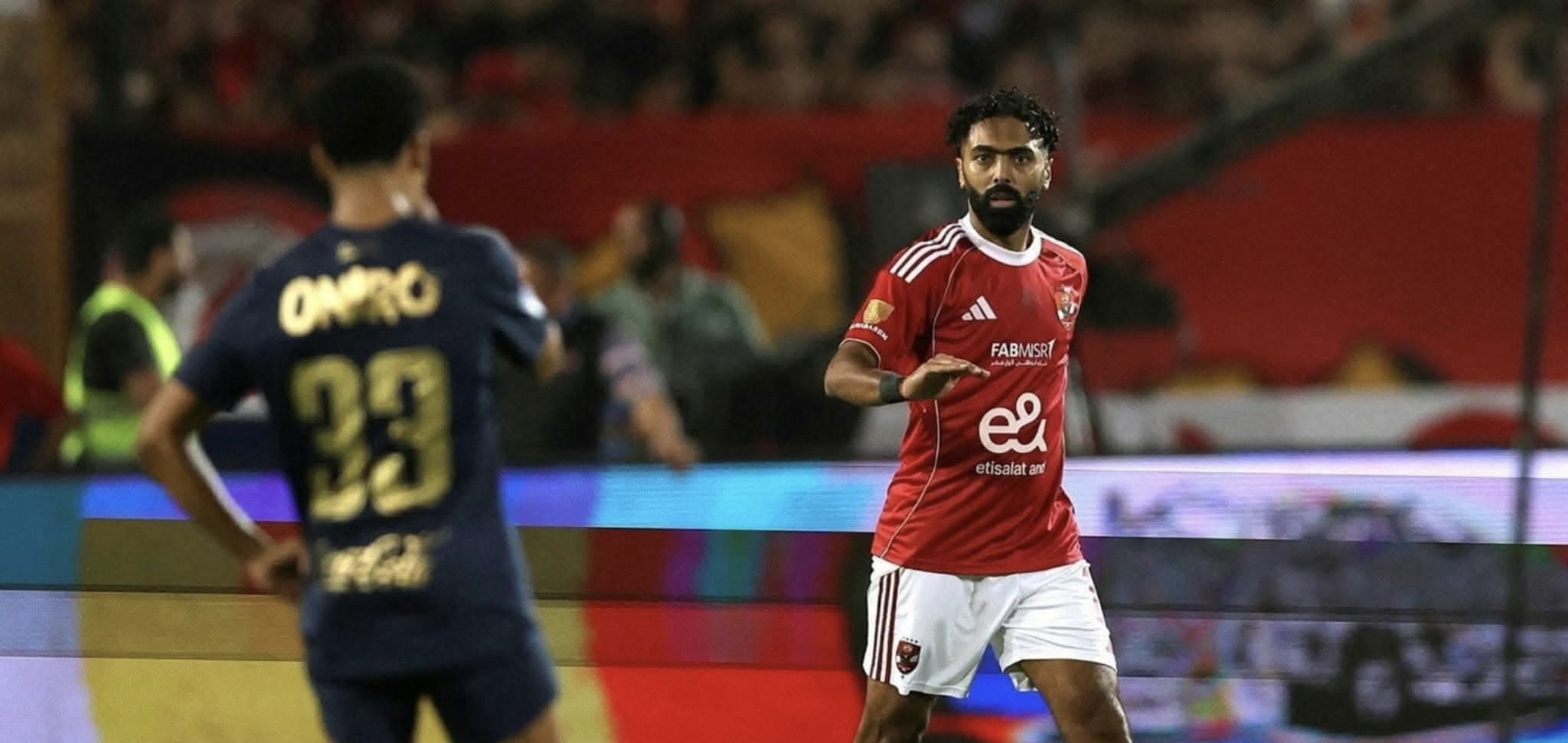A group of men playing football
AI-generated content may be incorrect.