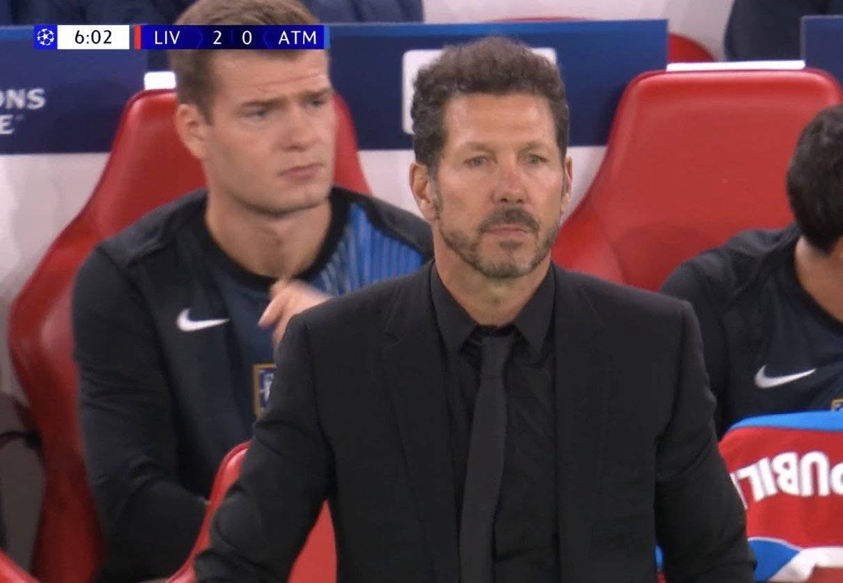 A group of men sitting in a stadium
AI-generated content may be incorrect.